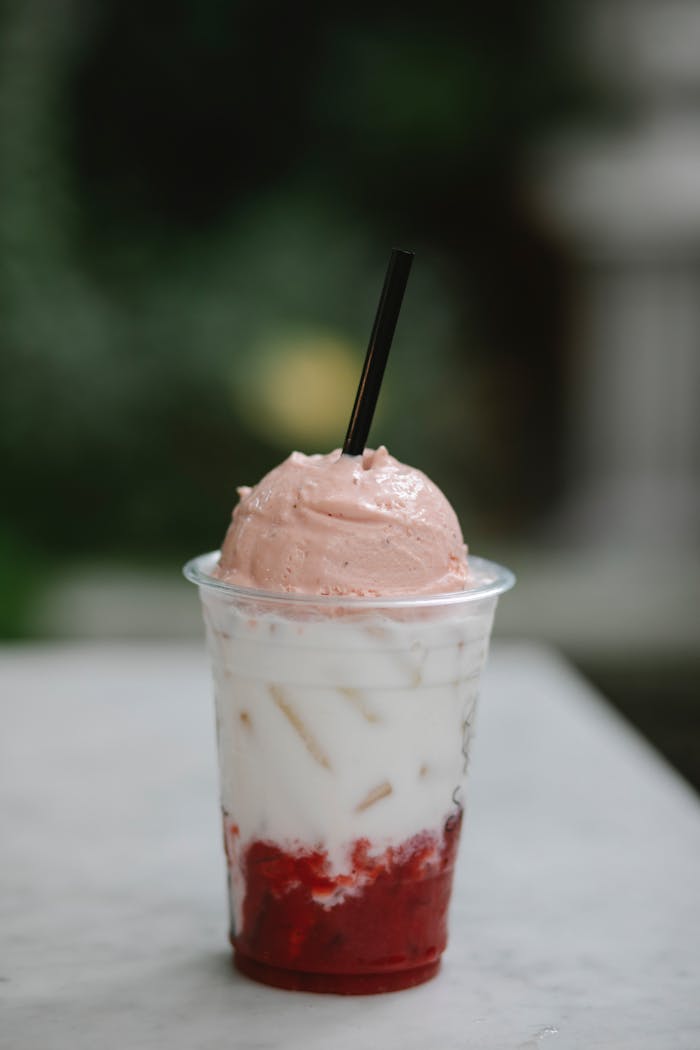 Delicious strawberry and cream beverage topped with ice cream, perfect for a summer treat.